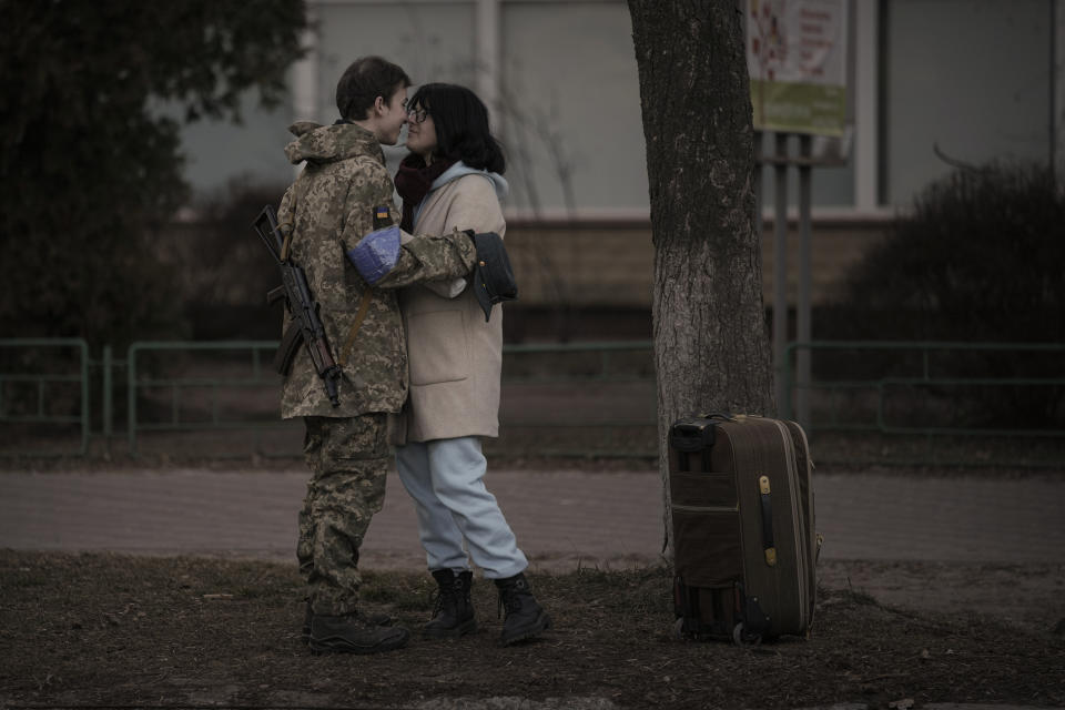 Bogdana, 17, rubs noses with her boyfriend, Ivan, 19, in Brovary, Ukraine, Sunday, March 20, 2022. Russian forces pushed deeper into Ukraine's besieged and battered port city of Mariupol on Saturday, where heavy fighting shut down a major steel plant and local authorities pleaded for more Western help. (AP Photo/Vadim Ghirda)