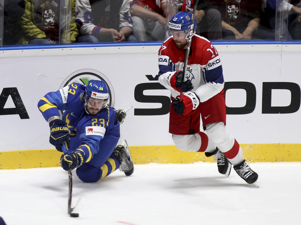 Sweden's Oliver Ekman Larsson, left, checks Czech Republic's Filip Hronek during the Ice Hockey World Championships group B match between Czech Republic and Sweden at the Andrej Nepela Arena in Bratislava, Slovakia, Friday, May 10, 2019. (AP Photo/Ronald Zak)