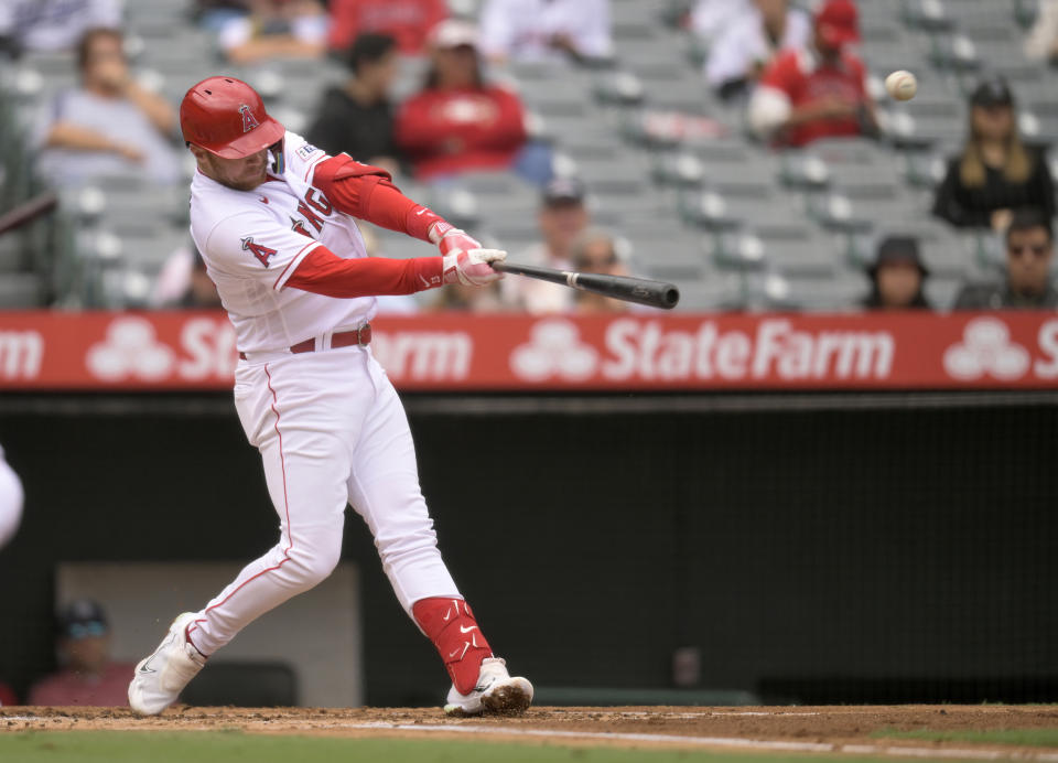 Los Angeles Angels second baseman Brandon Drury (23) hits a home run against the Oakland Athletics during the first inning of a baseball game Sunday, Oct. 1, 2023, in Anaheim. (AP Photo/John McCoy)
