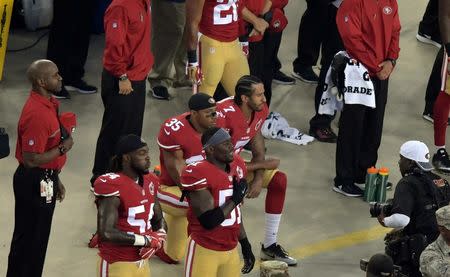 Sep 12, 2016; Santa Clara, CA, USA; San Francisco 49ers quarterback Colin Kaepernick (7) and free safety Eric Reid (35) kneel during the playing of the national anthem before a NFL game against the Los Angeles Rams at Levi's Stadium. Mandatory Credit: Kirby Lee-USA TODAY Sports