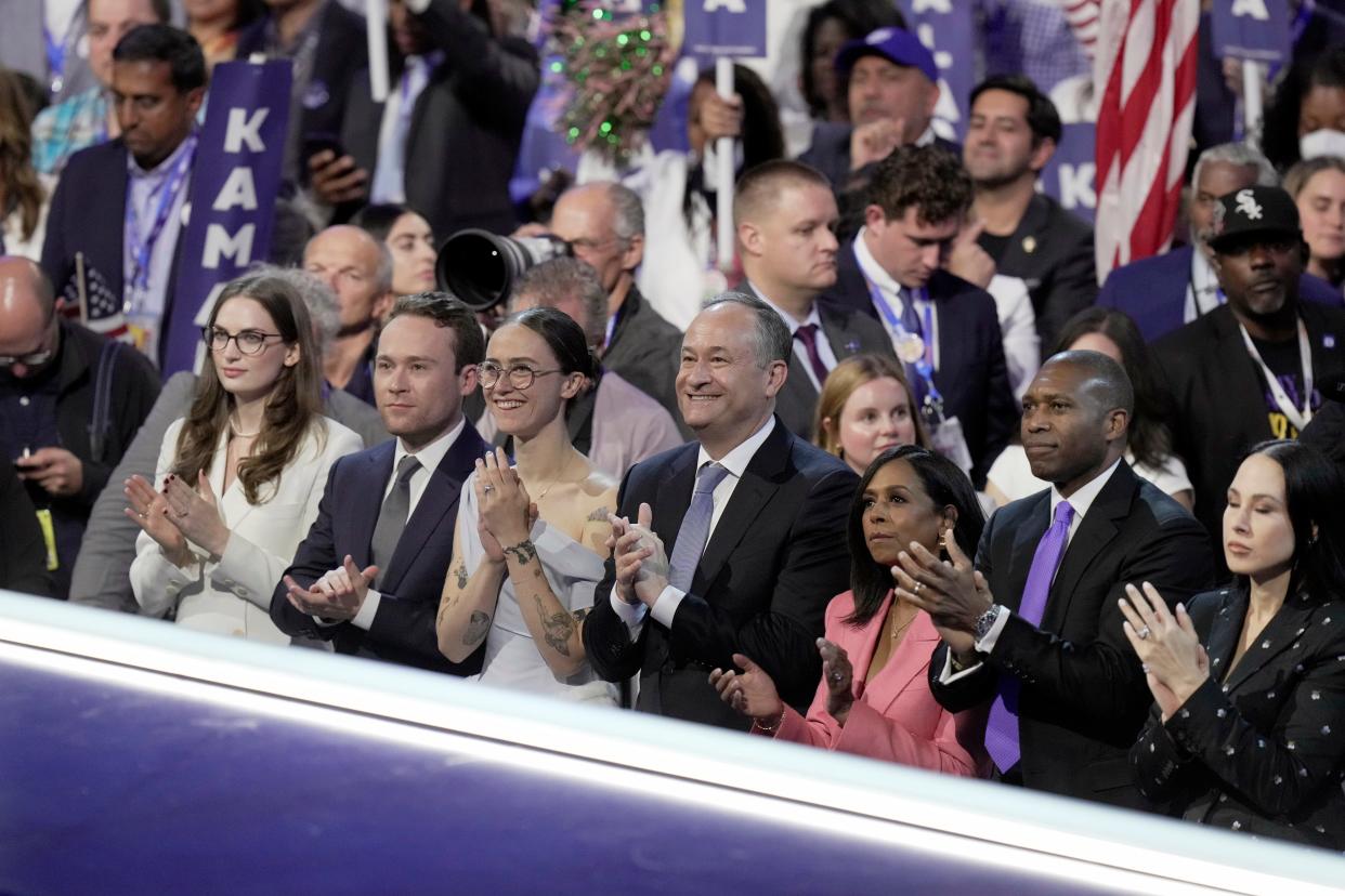 Second Gentleman Doug Emhoff (center) applauds. with family members (from left) Greenley Littlejohn,Cole Emhoff, Ella Emhoff, Maya Harris, Tony West, and Meena Harris as Democratic Presidential nominee Vice President Kamala Harris delivers her acceptance speech during the final day of the Democratic National Convention at the United Center.