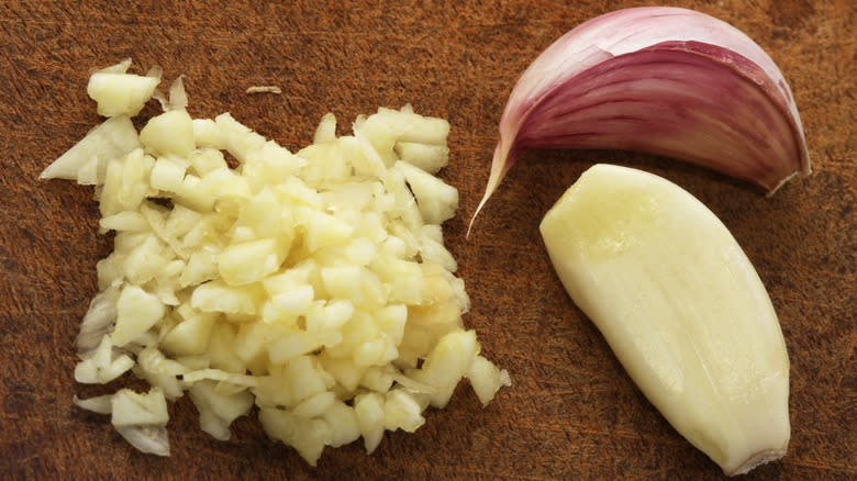 chopped garlic on chopping board