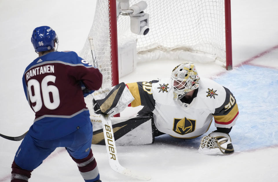 Vegas Golden Knights goaltender Jiri Patera, right, stops a shot by Colorado Avalanche right wing Mikko Rantanen during the third period of an NHL hockey game Wednesday, Jan. 10, 2024, in Denver. (AP Photo/David Zalubowski)