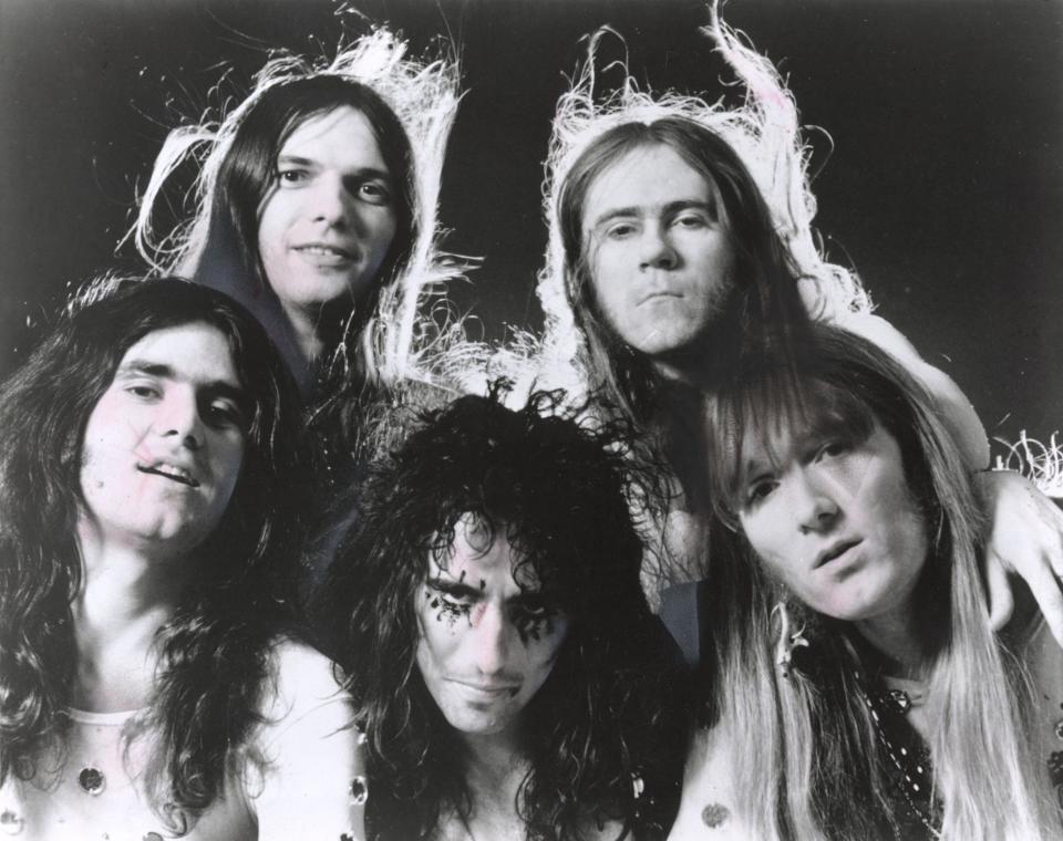 Alice Cooper band members, from left, Michael Bruce, Dennis Dunaway, Alice Cooper, Glen Buxton and Neal Smith take a group photo about 1970. Buxton and Smith were from Akron.