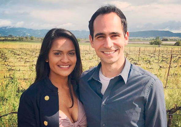 US couple stand in field