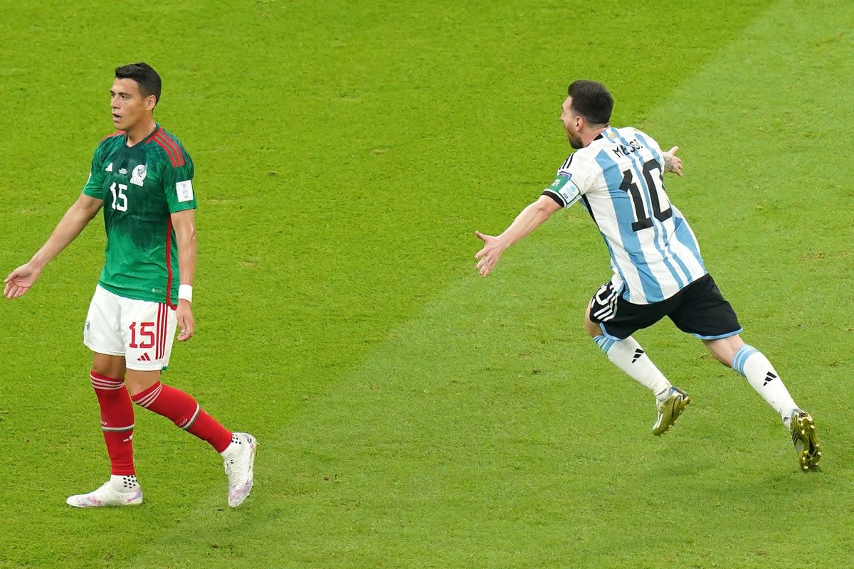 Lionel Messi, right, celebrates his crucial goal against Mexico (Adam Davy/PA) (PA Wire)