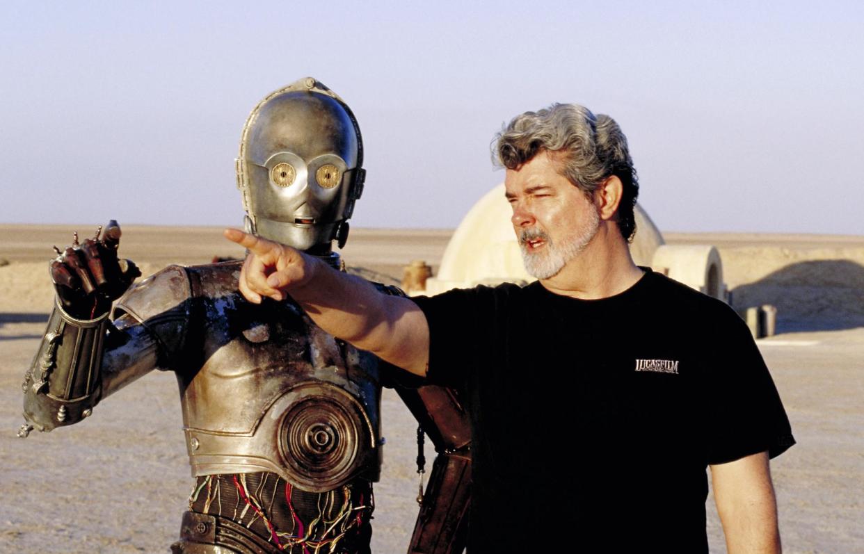 C-3PO and George Lucas on the set of Star Wars