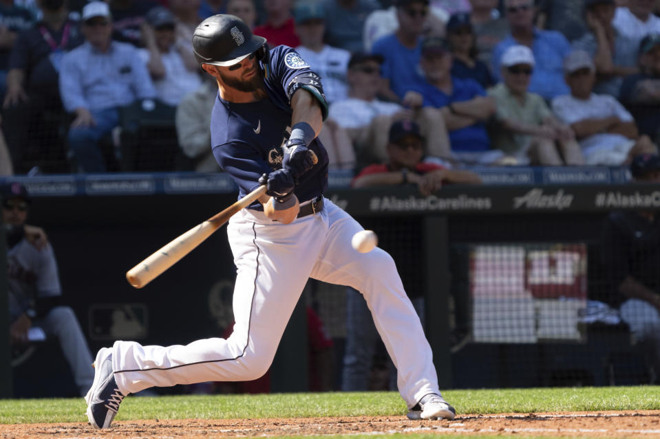 Seattle Mariners' Mitch Haniger hits a single off Cleveland Guardians relief pitcher Eli Morgan during the eighth inning of a baseball game, Thursday, Aug. 25, 2022, in Seattle. (AP Photo/Stephen Brashear)