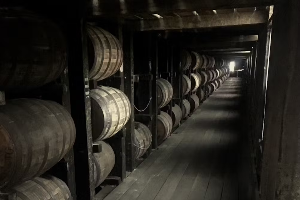 Barrels of bourbon age in a rickhouse, where they take on flavors from the barrel’s wood. <a href="https://www.gettyimages.com/detail/photo/kentucky-rickhouse-royalty-free-image/1192365040?phrase=rickhouse&adppopup=true" rel="nofollow noopener" target="_blank" data-ylk="slk:The_Goat_Path/iStock via Getty Images;elm:context_link;itc:0;sec:content-canvas" class="link ">The_Goat_Path/iStock via Getty Images</a>