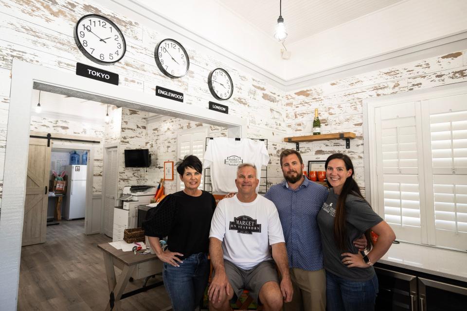 Terri, Scott, Ryan and Kalehli Hesse pose for a photo inside the offices of Paradise Exclusive Realty at 200 W. Dearborn Street, Englewood. The family will combine that lot with 232 W. Dearborn Street to expand their farmers market into The Market on Dearborn.