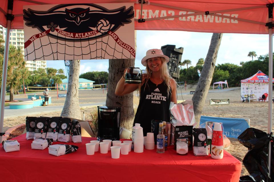 Senior Alivia Orvieto of the FAU beach volleyball team serves Winchell Mountain Coffee in FAU packaging. The Owls beach volleyball team has an NIL deal with Winchell Mountain.