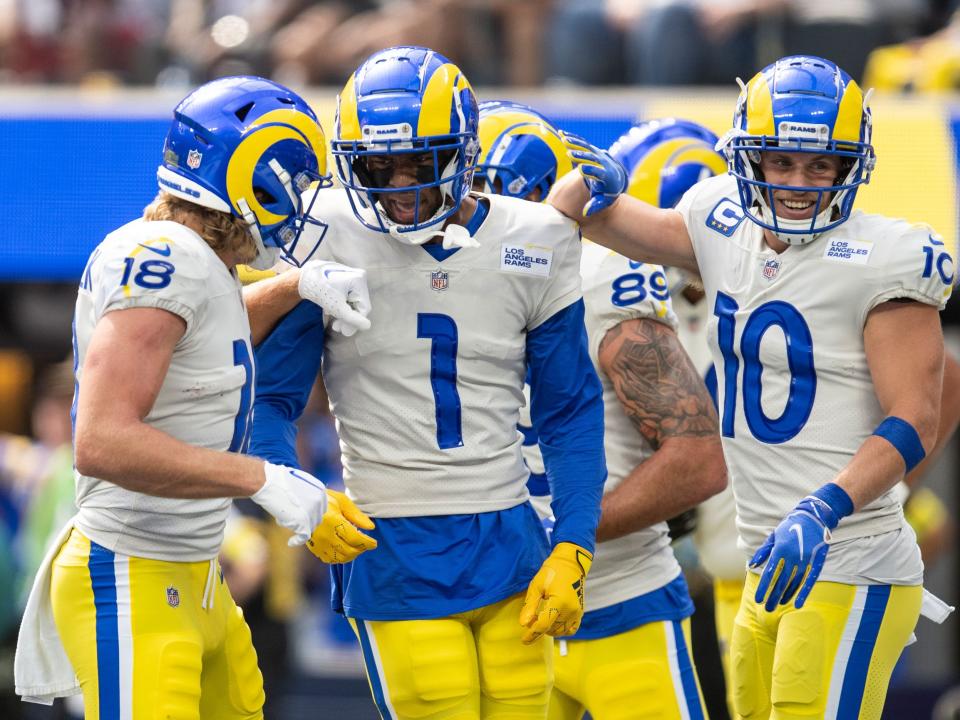 Rams wide receivers celebrate a touchdown against the Atlanta Falcons.