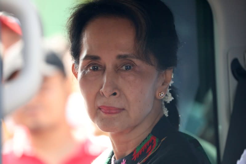 FILE PHOTO: Myanmar's State Counsellor Aung San Suu Kyi arrives at a school in Kawhmu