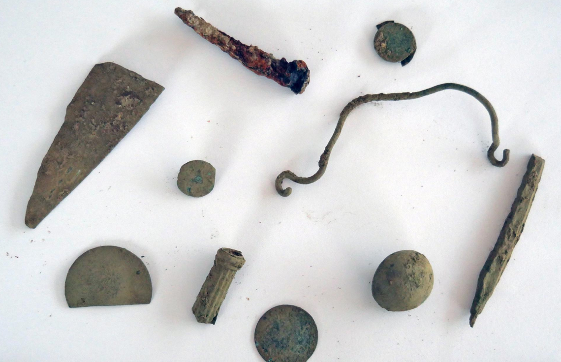An assemblage of metal objects was recovered, including nails and a handle.
