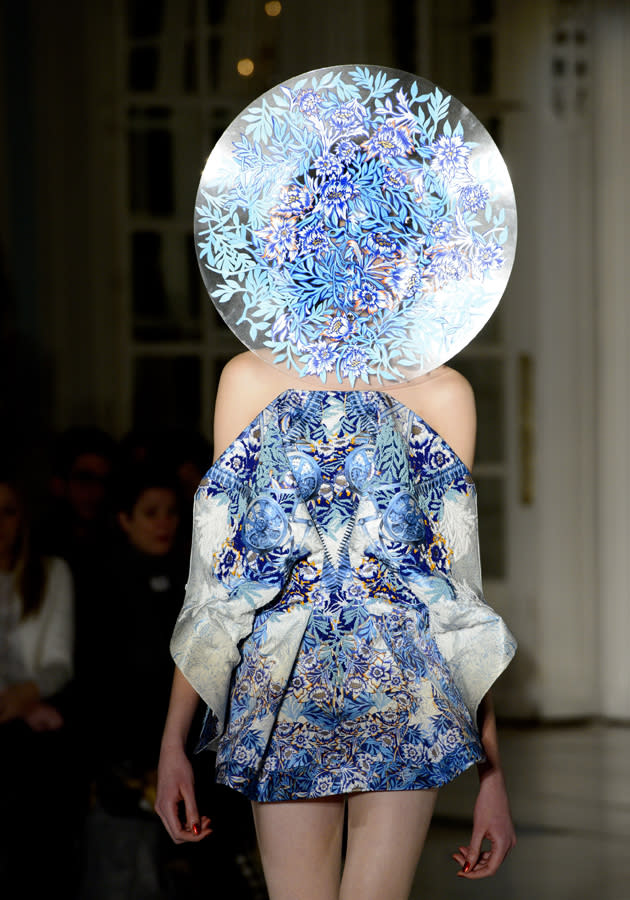 <b>London Fashion Week AW13: Fyodor Golan<br><br></b>How this model didn't fall over wearing this huge, beautifully-patterned headgear we don't know - but we love this blue graphic-printed mini dress.<br><br>©Rex<b><br><br></b>