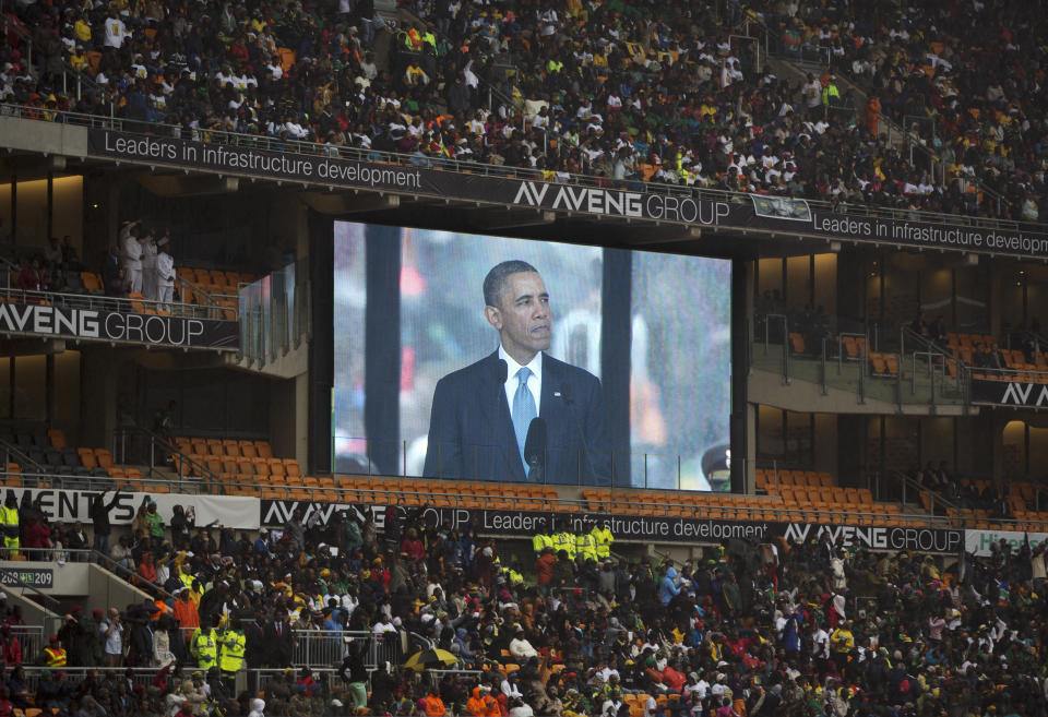 President Barrack Obama speaks to mourners attending the memorial service for former South African president Nelson Mandela at the FNB Stadium in Soweto near Johannesburg, Tuesday, Dec. 10, 2013. (AP Photo/Muhammed Muheisen)