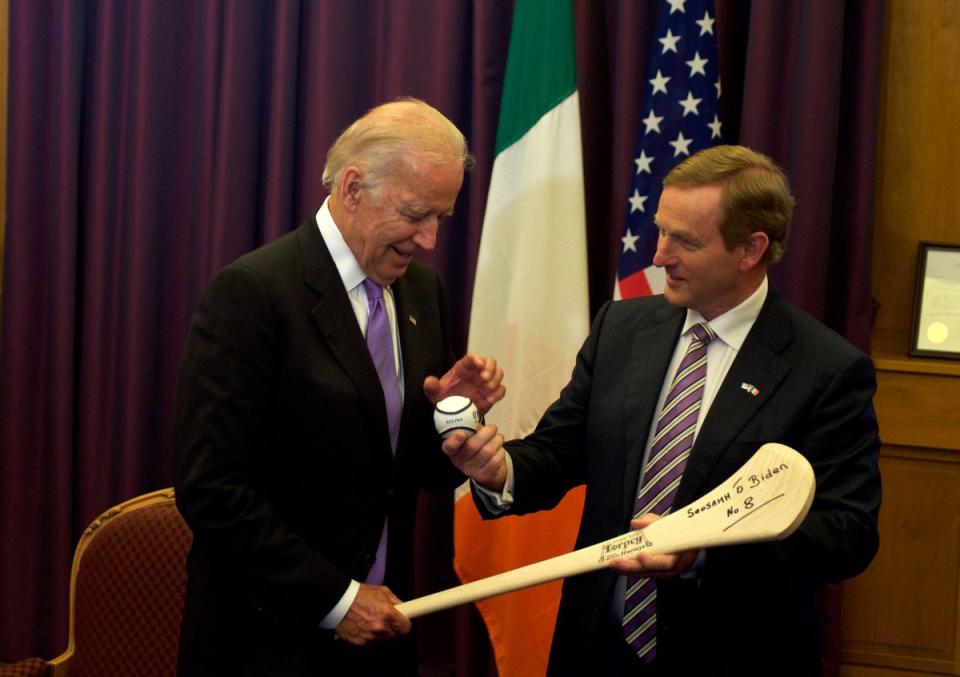 US Vice President Joe Biden receives a hurl as welcome gift from Irish Prime Minister Enda Kenny during a welcome ceremony at the Government Buildings in Dublin, Ireland on June 21, 2016 (AFP via Getty Images)