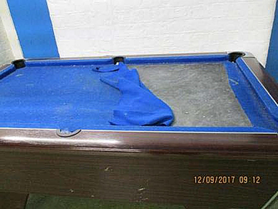 A wrecked pool table at HMP Liverpool (PA)