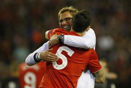 Britain Football Soccer - Liverpool v Villarreal - UEFA Europa League Semi Final Second Leg - Anfield, Liverpool, England - 5/5/16. Liverpool manager Juergen Klopp celebrates with Dejan Lovren after the game. Reuters / Phil Noble