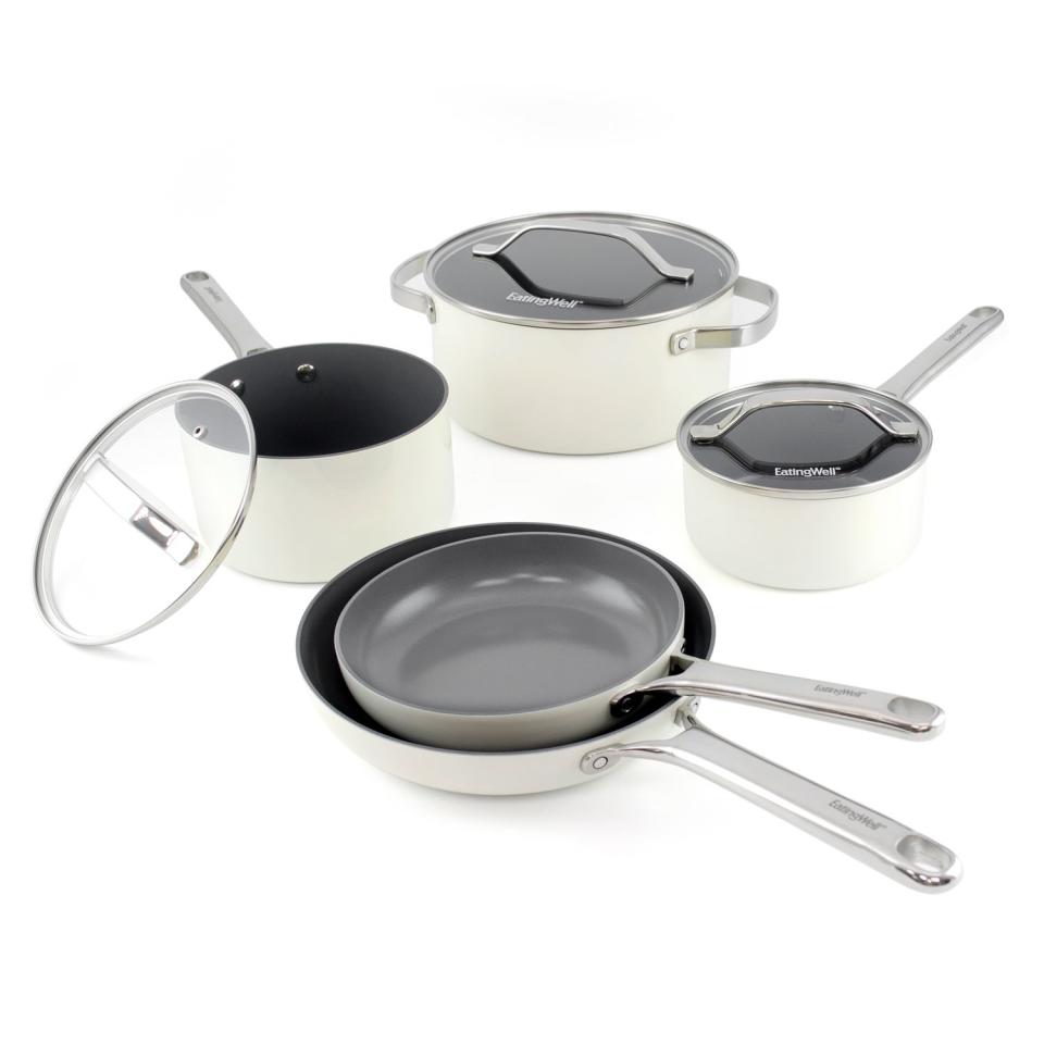 a photo of the EatingWell Cookware Set featuring one small sauce pan, one large sauce pan, a large pot, 3 lids, and two skillets
