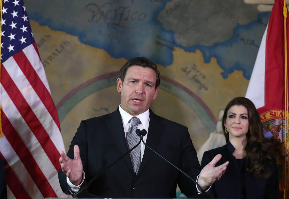 Newly sworn-in Gov. Ron DeSantis speaks, as his wife Casey DeSantis stands near him, during an event at the Freedom Tower where he named Barbara Lagoa to the Florida Supreme Court on January 09, 2019 in Miami, Florida. (Joe Raedle/Getty Images,)