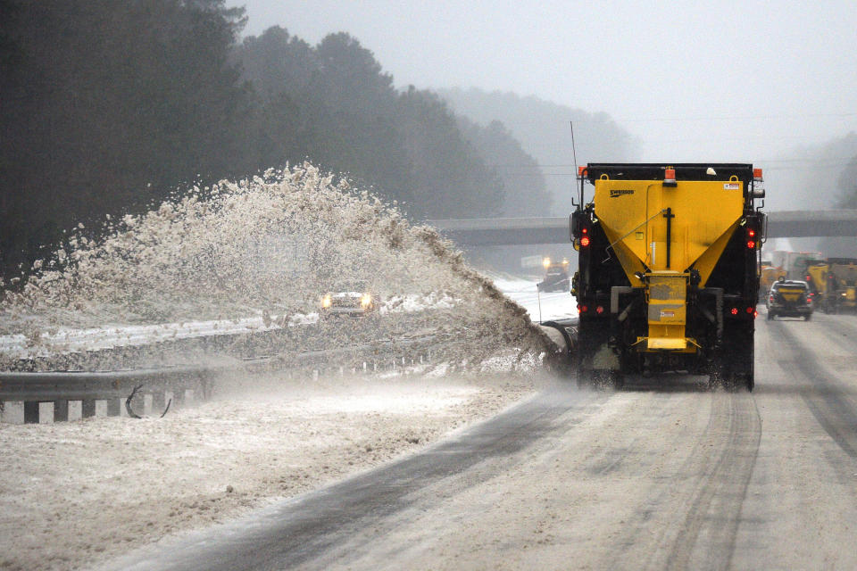 An NCDOT snow plow clears the roadway along Interstate 40 during a winter storm on January 22, 2016 in Chapel Hill, North Carolina. A major snowstorm is forecasted for the East Coast this weekend with some areas getting a possible one to two feet of snow.