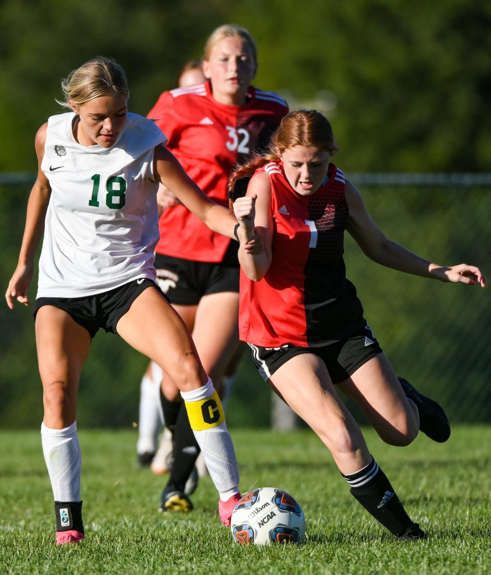 Edgewood’s Adrian Mondelli (1) and Monrovia’s Emery Newlin (18) fight for possession of the ball during their girls’ soccer match at Edgewood on Thursday, August 31, 2023.