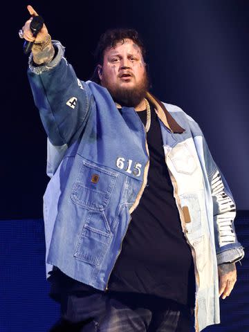 <p>Jason Kempin/Getty</p> Jelly Roll performs at Bridgestone Arena on December 09, 2022 in Nashville, Tennessee.