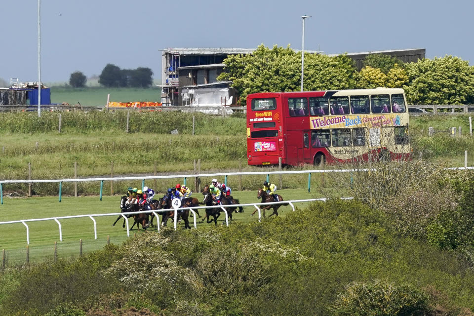 <p>A general view as runners turn into the straight in The Follow At The Races On Twitter Handicap at Brighton Racecourse. Picture date: Monday May 24, 2021.</p>
