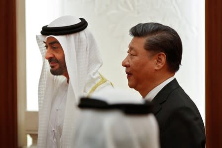 FILE PHOTO: Abu Dhabi's Crown Prince Sheikh Mohammed bin Zayed Al Nahyan and Chinese President Xi witness a signing ceremony in Beijing