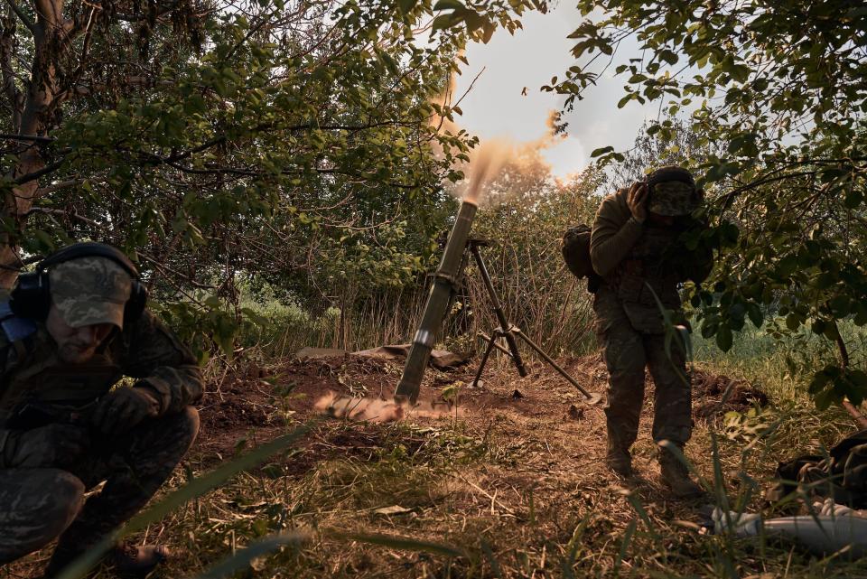 Ukrainian soldiers defending the front line in the Kharkiv region on May 20, 2024.