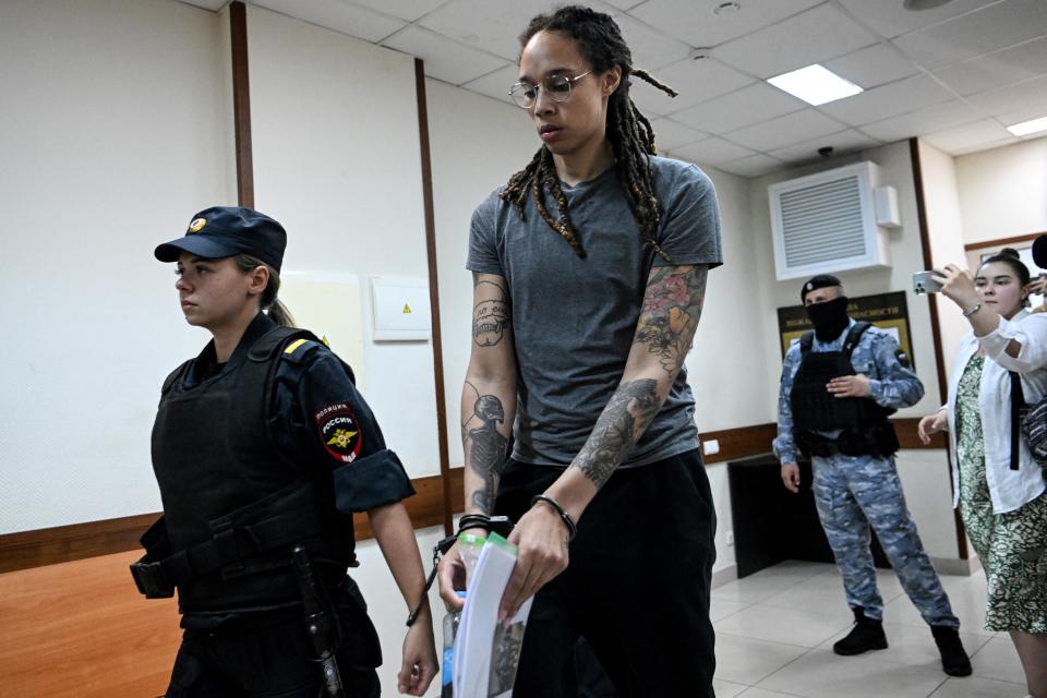 TOPSHOT - US Women National Basketball Association's (WNBA) basketball player Brittney Griner, who was detained at Moscow's Sheremetyevo airport and later charged with illegal possession of cannabis, leaves the courtroom before the court's final decision in Khimki outside Moscow, on August 4, 2022. - Russian prosecutors requested that US basketball star Brittney Griner be sentenced to nine and a half years in prison on drug smuggling charges. Her hearing comes with tensions soaring between Moscow and Washington over Russia's military intervention in Ukraine that has sparked international condemnation and a litany of Western sanctions. (Photo by Kirill KUDRYAVTSEV / POOL / AFP) (Photo by KIRILL KUDRYAVTSEV/POOL/AFP via Getty Images)