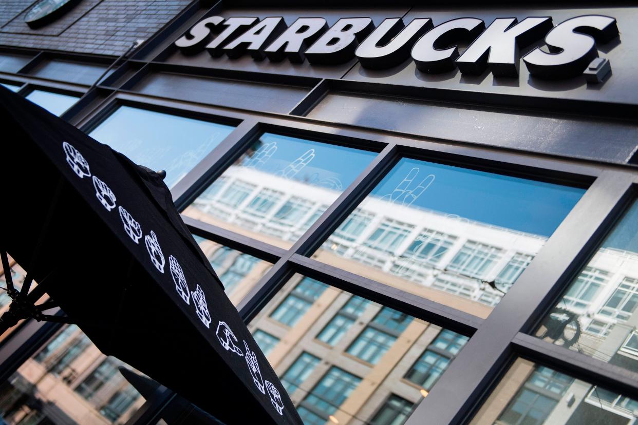 Starbucks will give all its US employees a pay raise of at least 10 per cent next month, the firm has confirmed (AFP via Getty Images)