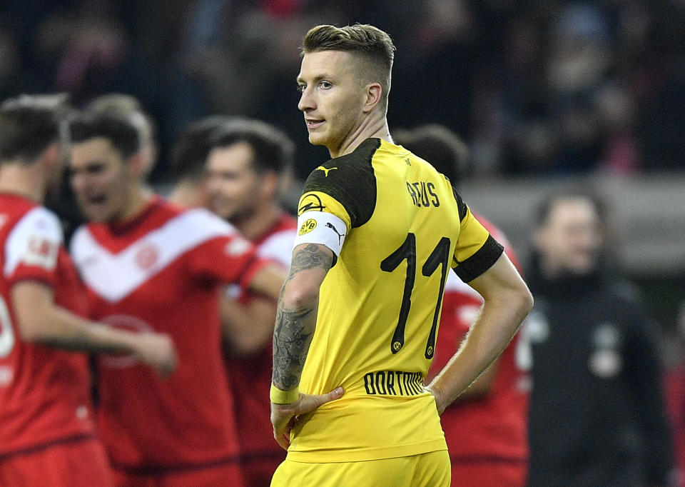 Dortmund's Marco Reus looks disappointed after the German Bundesliga soccer match between Fortuna Duesseldorf and Borussia Dortmund in Duesseldorf, Germany, Tuesday, Dec. 18, 2018. Fortuna defeated Dortmund with 2-1. (AP Photo/Martin Meissner)