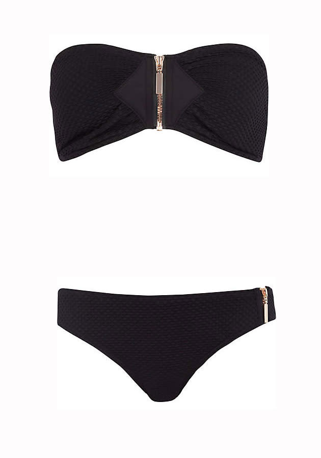 Black Textured Zip Bikini Top (£15.00) and Bottoms (£10.00) – <a href="http://www.riverisland.com/" rel="nofollow noopener" target="_blank" data-ylk="slk:River Island;elm:context_link;itc:0;sec:content-canvas" class="link ">River Island</a><br><br>Boyish figures will suit this bandeau-style bikini.