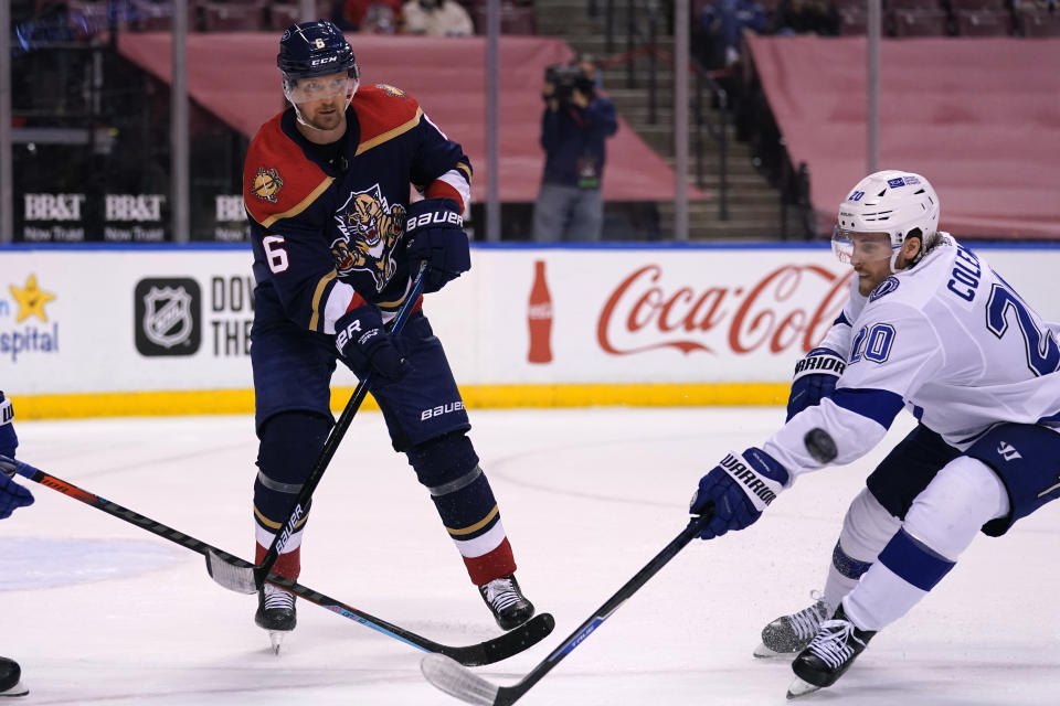 Tampa Bay Lightning center Blake Coleman (20) and Florida Panthers defenseman Anton Stralman (6) go for the puck during the third period of an NHL hockey game, Saturday, Feb. 13, 2021, in Sunrise, Fla. (AP Photo/Lynne Sladky)