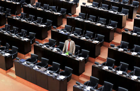 FILE PHOTO: Parliament member Wijeyadasa Rajapakshe who backs newly appointed Prime Minister Mahinda Rajapaksa speaks while other members are boycotting parliament session in Colombo, Sri Lanka November 29, 2018. REUTERS/Dinuka Liyanawatte/File photo