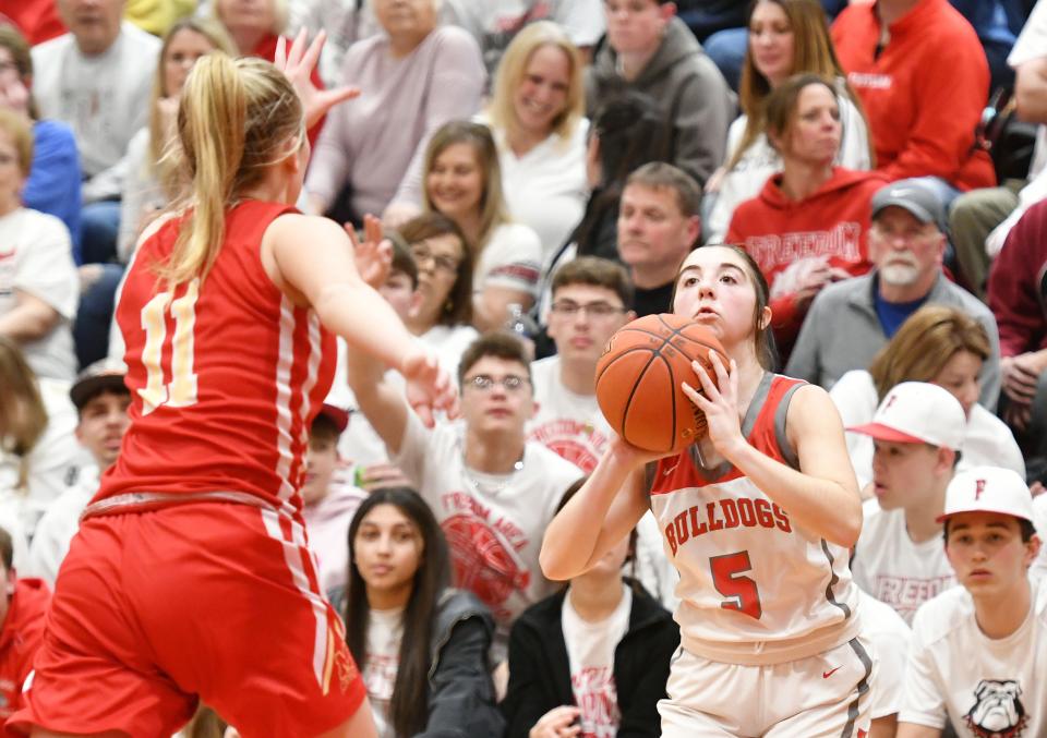 Freedom's Olivia Henderson shoots from the 3-point line during Friday night's PIAA Class 2A playoff game at Freedom High School.