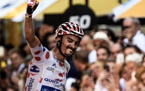 Julian Alaphilippe pumps his fist in the air - Credit: afp