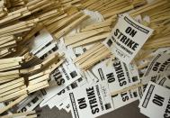 Hundreds of signs saying "On Strike" lay stockpiled in a store room of the Chicago Teachers Union strike headquarters on Saturday, Sept. 8, 2012 in Chicago. The union has vowed to strike on Monday, Sept. 10, 2012 if an agreement over teachers' contracts is not reached with Chicago Public Schools by Monday. (AP Photo/Sitthixay Ditthavong)