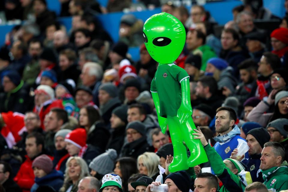 Northern Ireland fans hold up an inflatable alien during a game against Switzerland: Action Images via Reuters/Jason Cairnduff