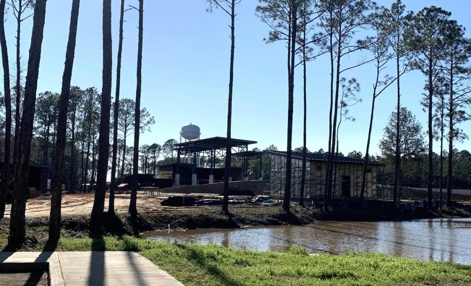 A view through the trees shows the Sound Amphitheater, under construction in Gautier. The venue will be ready for shows in April.