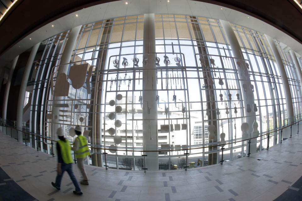 This April 12, 2013, photo made with a fisheye lens shows a sculpture made from musical instruments in the Music City Center in Nashville, Tenn. Nashville's new convention center is transforming the look of downtown with its wavy roof dominating six city blocks, but tourism officials hope the eye-catching facility will also show business travelers a revitalized Music City. (A P Photo/Mark Humphrey)