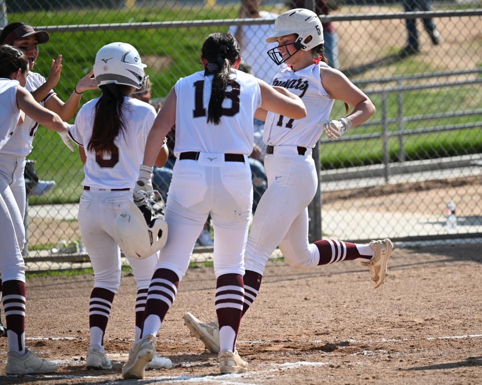 Granite Hills’ Mylie Shepard is greeted at home plate after hitting a two-run homer to tie the game 5-5 against Barstow in the second inning on Thursday, March 21, 2024 in Apple Valley. Granite Hills defeated Barstow 11-9.