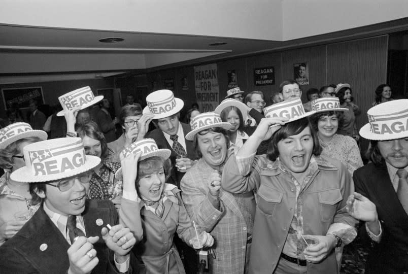 (Original Caption) Raleigh, N.C.: Jubilant supporters and campaign workers for Ronald Reagan cheer at a local victory celebration after learning of Reagan’s upset over Pres. Ford in North Carolina’s GOP primary.