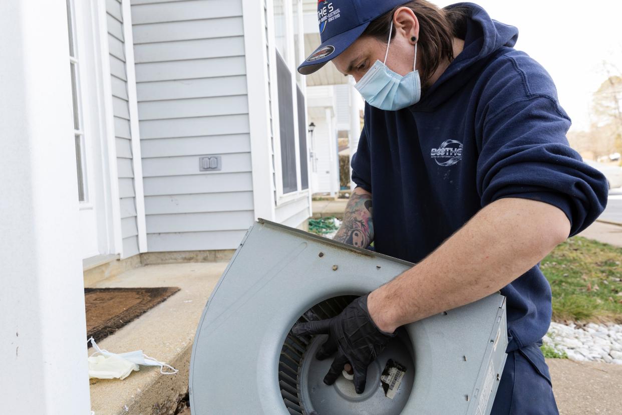 Jeremy Linehan, a technician at Boothe’s Heating & Air, cleans the blower housing outside to remove dust and biological growth that has formed on it. HVAC systems can provide an ideal environment for biological growth because of moisture and darkness, and a home with a lot of carpet, pets or people can contribute to the dirt and biological pollutants.