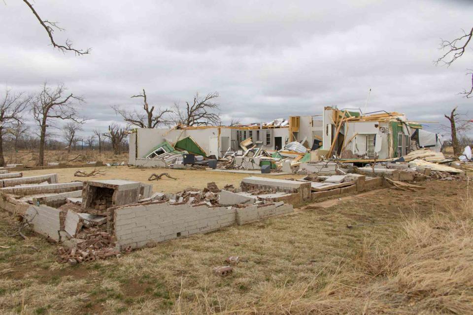 <p>Dan Tian/Xinhua/Getty Images</p> A home damaged by a tornado in Jacksboro, northern Texas on March 22, 2022.