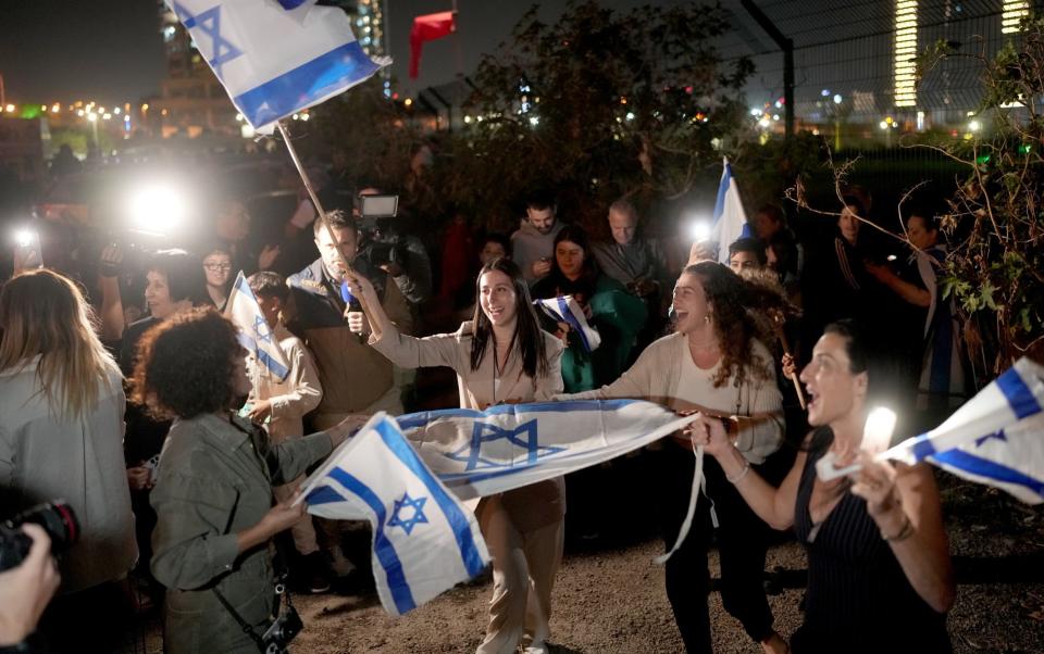 Family and friends gather as a helicopter arrives with hostages at Schneider medical centre on November 24, 2023 in Petah Tivka, Israel. A total of 50 hostages currently held by Hamas are to be released during a four-day truce with Israel.