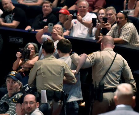 Las Vegas police lead Michael Steven Sandford from Republican U.S. presidential candidate Donald Trump's campaign rally at the Treasure Island Hotel & Casino in Las Vegas, Nevada June 18, 2016. REUTERS/David Becker