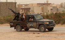 Members of the Libyan internationally recognised government forces take position during the fighting with the Eastern forces in Ain Zara, in Tripoli, Libya April 21, 2019. REUTERS/Ahmed Jadallah